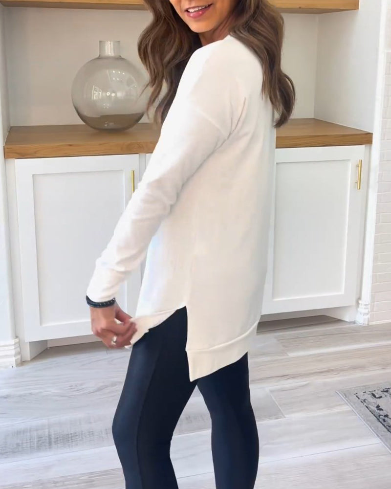 Damebluse med rund hals, lange ærmer og lang lige model
