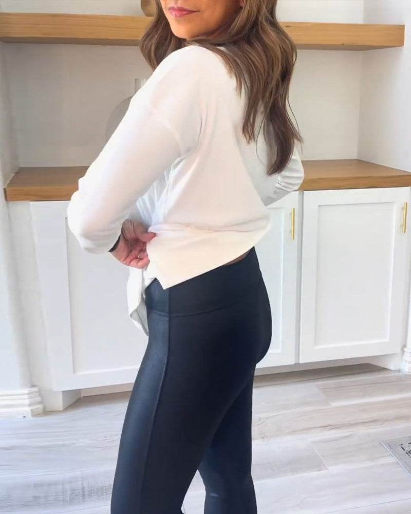 Damebluse med rund hals, lange ærmer og lang lige model
