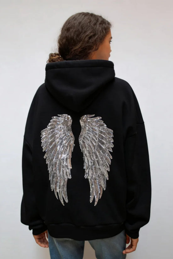 Damehoodie med hætte og pailletvinger på ryggen